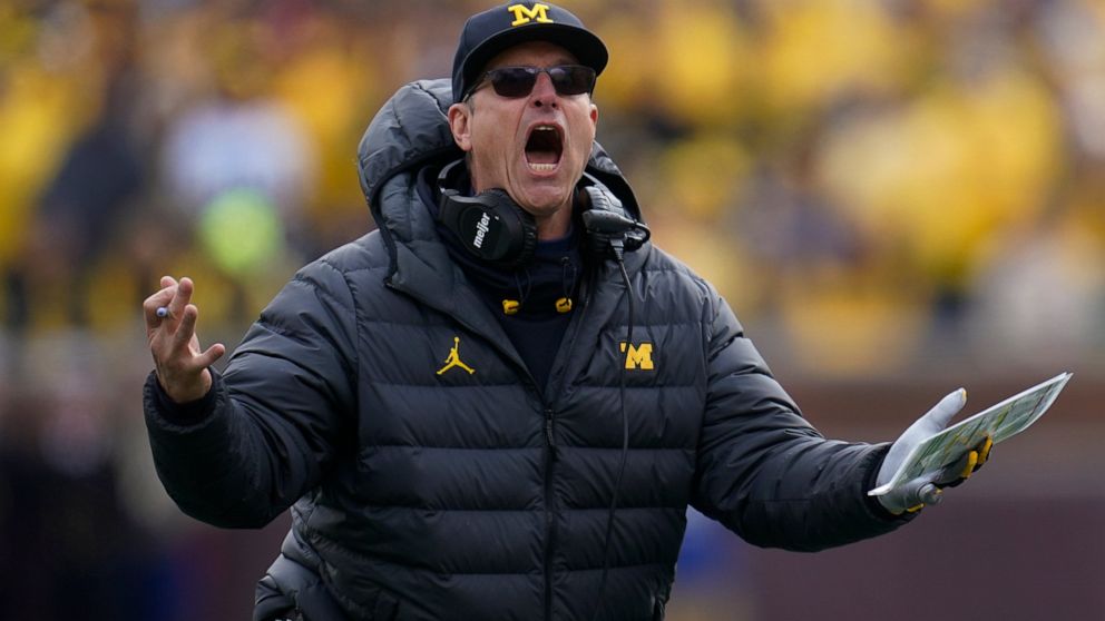 Michigan head coach Jim Harbaugh argues a call against Penn State in the second half of an NCAA college football game in Ann Arbor, Mich., Saturday, Oct. 15, 2022. (AP Photo/Paul Sancya)