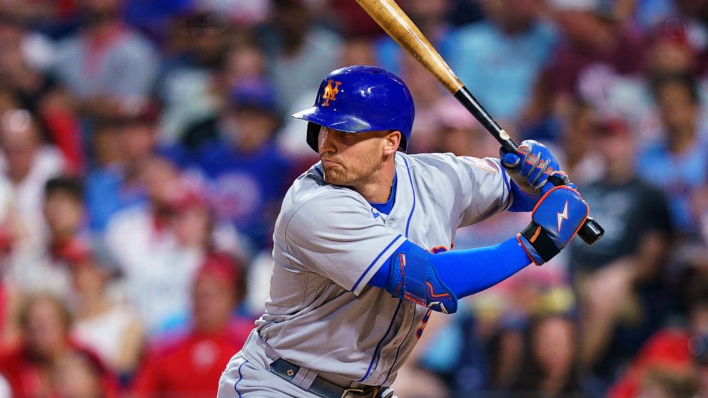 FILE - New York Mets' Brandon Nimmo bats during the second baseball game of the team's doubleheader against the Philadelphia Phillies, Aug. 20, 2022, in Philadelphia. Nimmo is staying with the free-spending Mets, agreeing to a $162 million, eight-yea