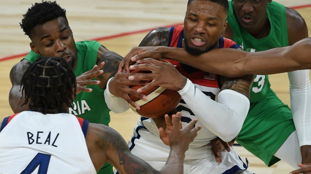 United States' Damian Lillard (6) defends the ball against Nigeria during an exhibition basketball game Saturday, July 10, 2021, in Las Vegas. (AP Photo/David Becker)
