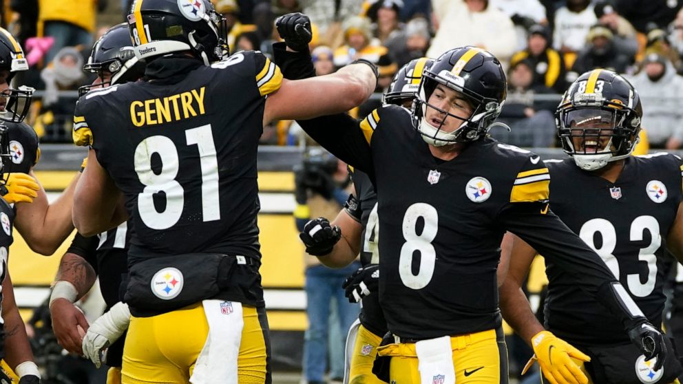 Pittsburgh Steelers quarterback Kenny Pickett (8) celebrates after scoring on a one-yard quarterback sneak during the second half of an NFL football game against the New Orleans Saints in Pittsburgh, Sunday, Nov. 13, 2022. (AP Photo/Keith Srakocic)