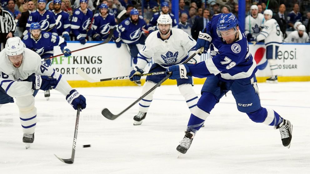 Tampa Bay Lightning center Ross Colton (79) fires the puck past Toronto Maple Leafs defenseman Ilya Lyubushkin (46) and center Colin Blackwell (11) for a goal during the second period in Game 4 of an NHL hockey first-round playoff series Sunday, May 