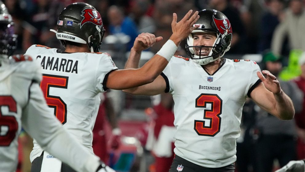 Tampa Bay Buccaneers place kicker Ryan Succop (3) celebrates his game-winning field goal against the Arizona Cardinals with punter Jake Camarda (5) during the second half of an NFL football game, Sunday, Dec. 25, 2022, in Glendale, Ariz. The Buccanee