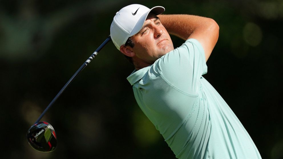 Scottie Scheffler watches his shot on the fifth tee during the third round of the Tour Championship golf tournament at East Lake Golf Club Saturday, Aug. 27, 2022, in Atlanta. (AP Photo/John Bazemore)