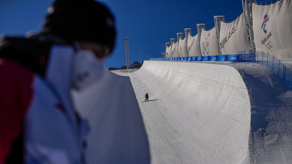 A skier trains on the half-pipe ahead of at the 2022 Winter Olympics, Tuesday, Feb. 1, 2022, in Zhangjiakou, China. (AP Photo/Francisco Seco)