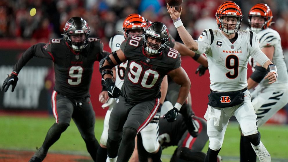 Cincinnati Bengals quarterback Joe Burrow (9) throws a pass against the Tampa Bay Buccaneers during the second half of an NFL football game, Sunday, Dec. 18, 2022, in Tampa, Fla. (AP Photo/Chris O'Meara)