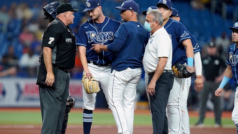 Tampa Bay Rays starting pitcher Shane McClanahan, second from left is taken out of the game against the Houston Astros during the fifth inning of a baseball game Tuesday, Sept. 20, 2022, in St. Petersburg, Fla. (AP Photo/Chris O'Meara)