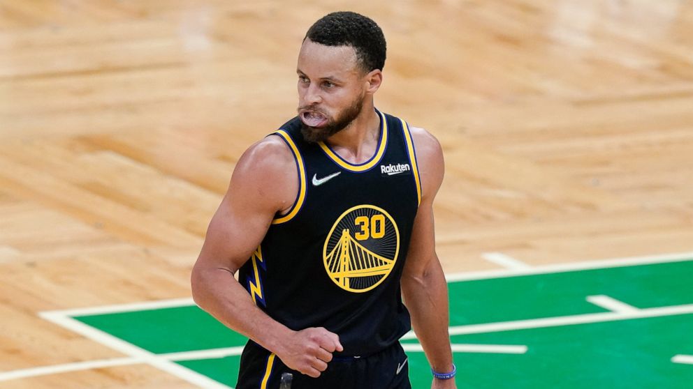 Golden State Warriors guard Stephen Curry (30) reacts during the first quarter of Game 4 of basketball's NBA Finals against the Boston Celtics, Friday, June 10, 2022, in Boston. (AP Photo/Steven Senne)