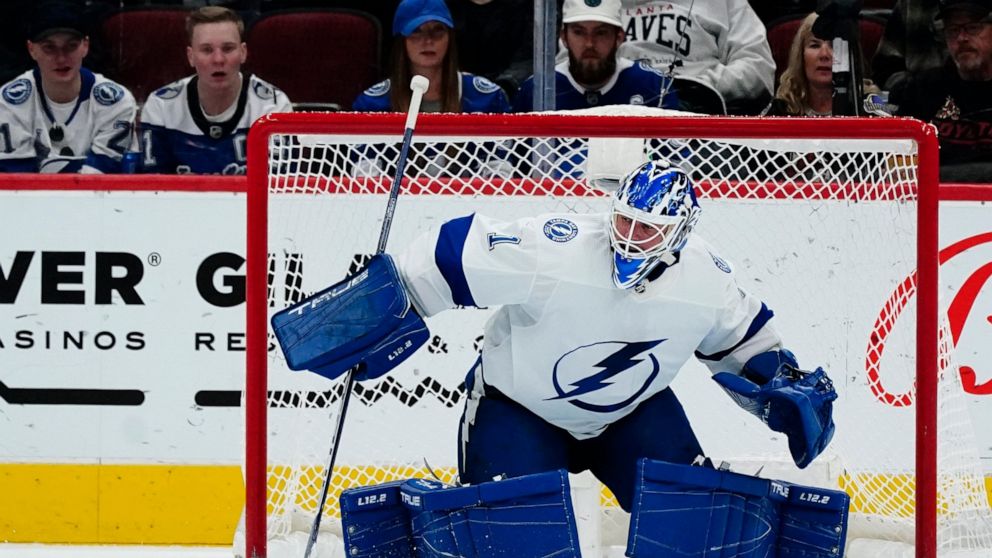 Tampa Bay Lightning goaltender Brian Elliott makes a save against the Arizona Coyotes during the second period of an NHL hockey game Friday, Feb. 11, 2022, in Glendale, Ariz. (AP Photo/Ross D. Franklin)