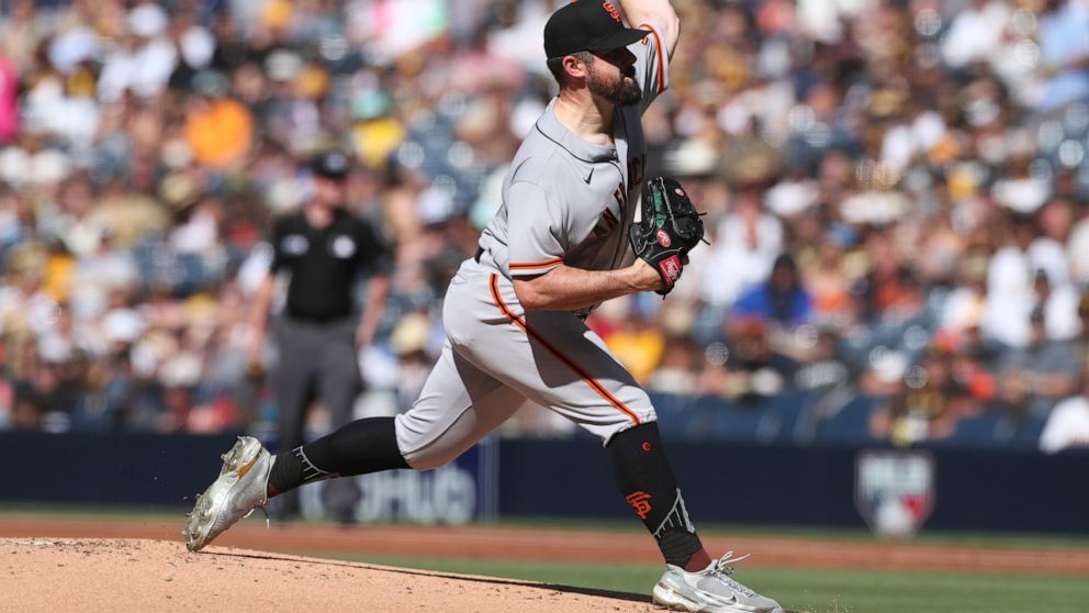 San Francisco Giants starting pitcher Carlos Rodon delivers to San Diego Padres' Ha-Seong Kim in the first inning of a baseball game Saturday, July 9, 2022, in San Diego. (AP Photo/Derrick Tuskan)
