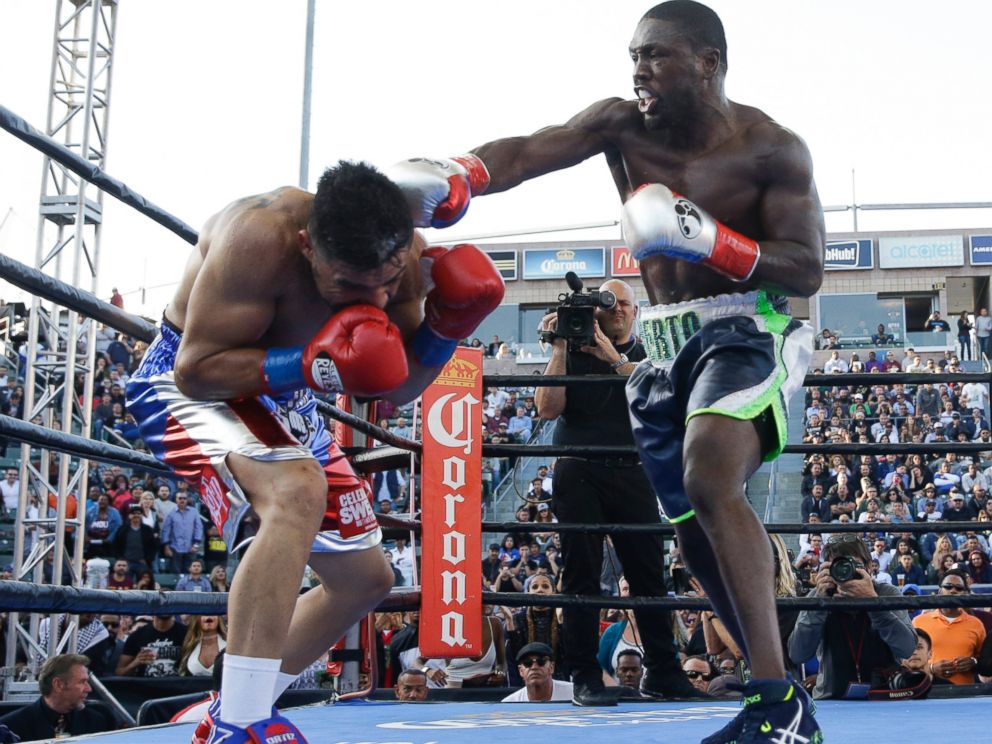Andre Berto, right, lands a punch to Victor Ortiz during the fourth round of a welterweight boxing match, Saturday, April 30, 2016, in Carson, Calif. Berto won by knockout in the fourth round.