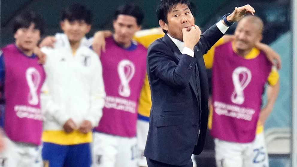 Japan's head coach Hajime Moriyasu whistles during the World Cup group E soccer match between Japan and Spain, at the Khalifa International Stadium in Doha, Qatar, Thursday, Dec. 1, 2022. (AP Photo/Aijaz Rahi)