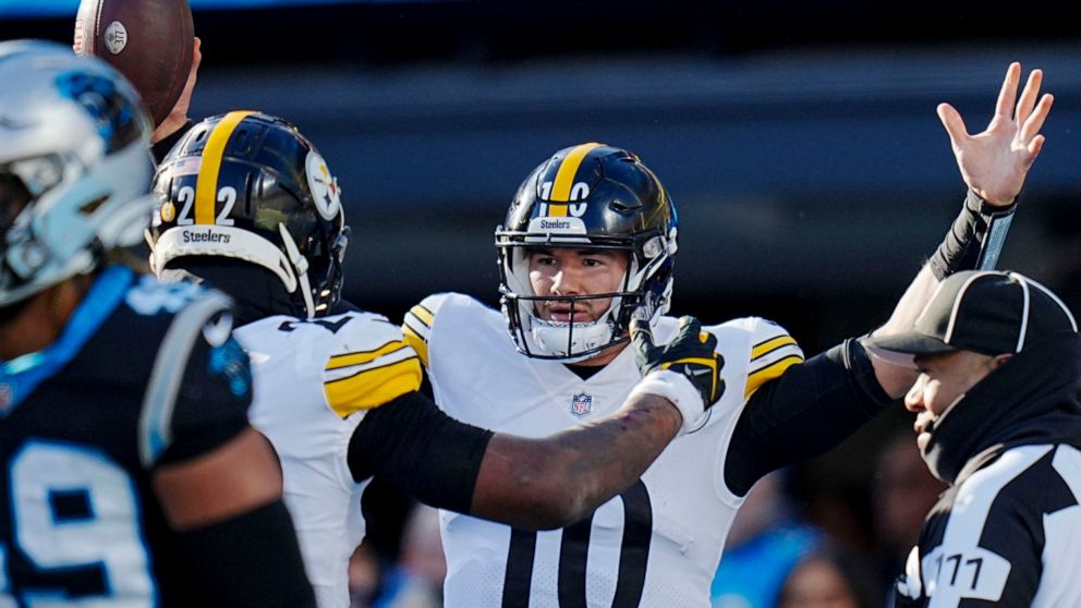 Pittsburgh Steelers quarterback Mitch Trubisky celebrates after scoring during the second half of an NFL football game between the Carolina Panthers and the Pittsburgh Steelers on Sunday, Dec. 18, 2022, in Charlotte, N.C. (AP Photo/Rusty Jones)