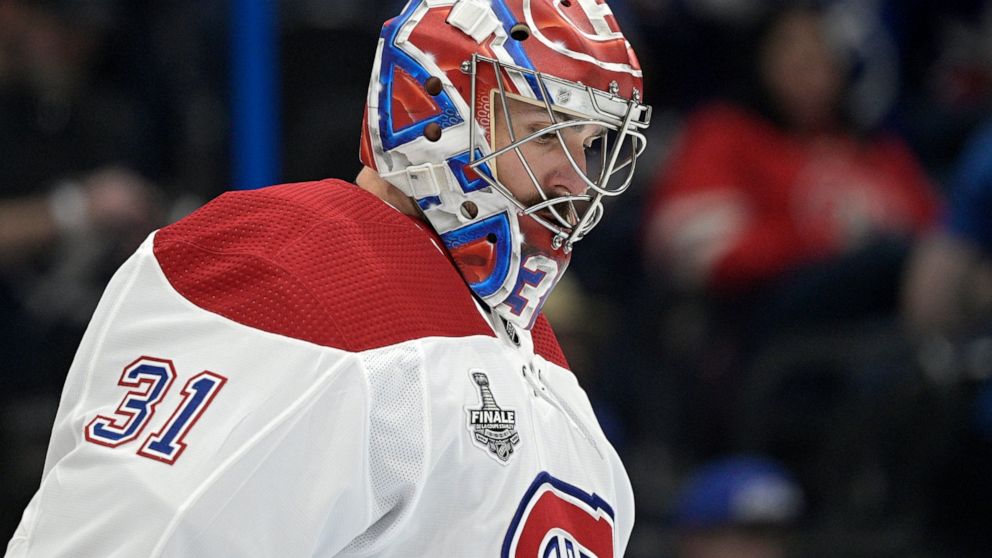 FILE - Montreal Canadiens goaltender Carey Price stands in the crease during the second period of Game 2 of the team's NHL hockey Stanley Cup Finals against the Tampa Bay Lightning on June 30, 2021, in Tampa, Fla. Price said Tuesday, Nov. 9, that he 