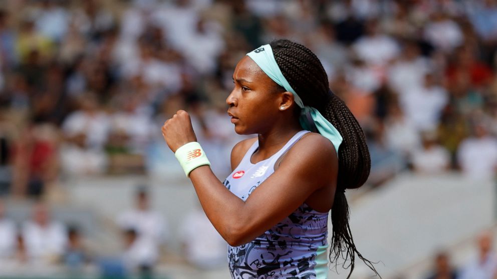 Coco Gauff of the U.S.celebrates scoring a point as she plays Italy's Martina Trevisan during their semifinal match of the French Open tennis tournament at the Roland Garros stadium Thursday, June 2, 2022 in Paris. (AP Photo/Jean-Francois Badias)