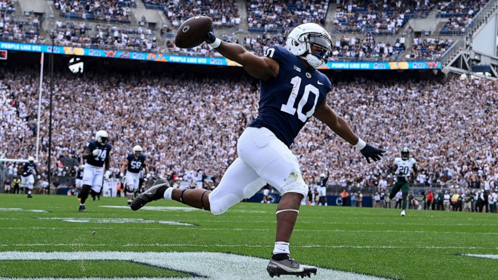 Penn State running back Nicholas Singleton (10) celebrates as he scores on a 70-yard touchdown run in the first half of an NCAA college football game, Saturday, Sept. 10, 2022, in State College, Pa. (AP Photo/Barry Reeger)