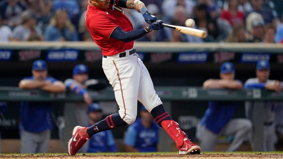 FILE - Minnesota Twins' Carlos Correa hits an RBI double during the third inning of a baseball game against the Kansas City Royals, Tuesday, Sept. 13, 2022, in Minneapolis. In a wild twist overnight, Carlos Correa agreed to a $315 million, 12-year co