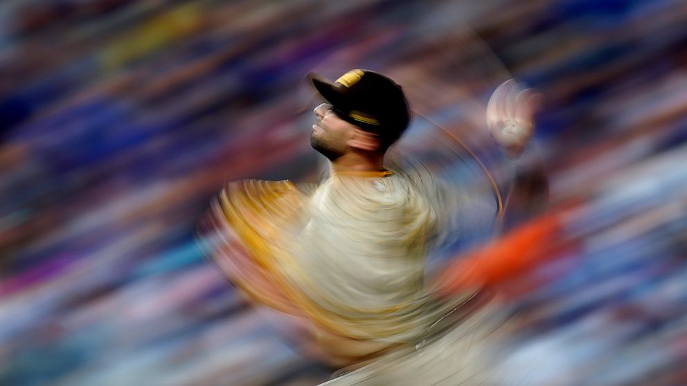 San Diego Padres relief pitcher Nick Martinez throws during the ninth inning of a baseball game against the Kansas City Royals Saturday, Aug. 27, 2022, in Kansas City, Mo. (AP Photo/Charlie Riedel)