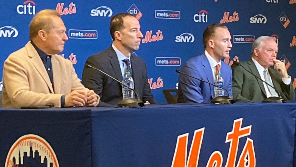 Agent Scott Boras, from left, New York Mets general manager Billy Eppler, Mets center fielder Brandon Nimmo and Mets manager Buck Showalter attend a baseball press conference to announce Nimmo's $162 million, eight-year contract, Thursday, Dec. 15, 2