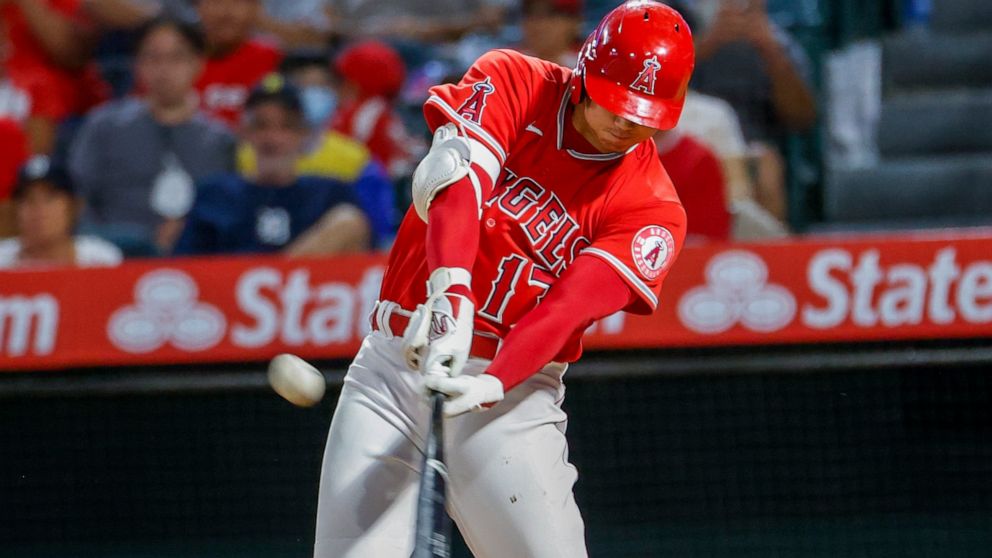 Los Angeles Angels' Shohei Ohtani hits a solo home run during the seventh inning of a baseball game against the Detroit Tigers in Anaheim, Calif., Monday, Sept. 5, 2022. (AP Photo/Ringo H.W. Chiu)