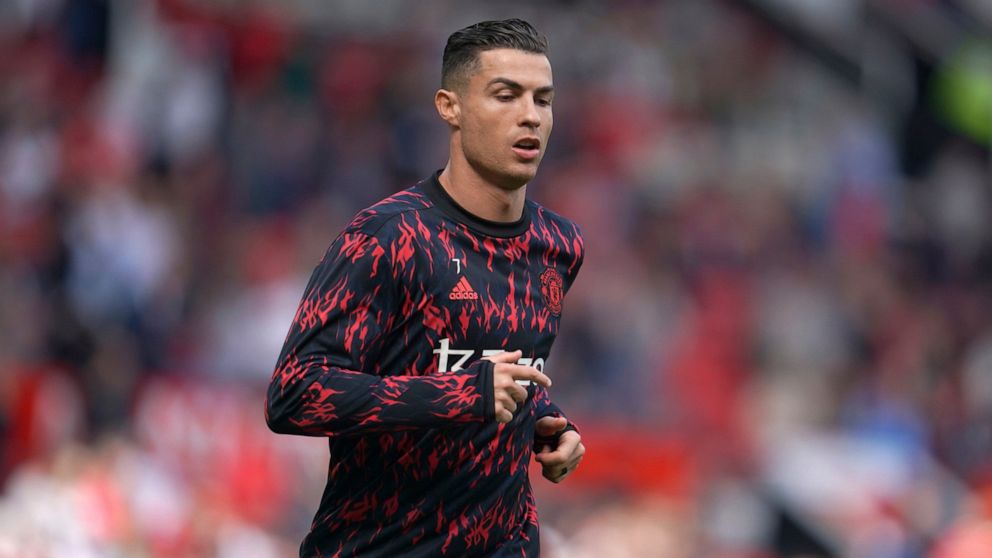 Manchester United's Cristiano Ronaldo warms up before the English Premier League soccer match between Manchester United and Norwich City at Old Trafford stadium in Manchester, England, Saturday, April 16, 2022. (AP Photo/Jon Super)