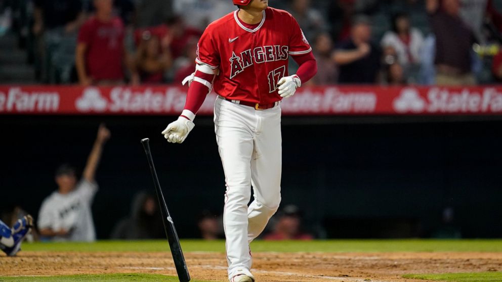 Los Angeles Angels designated hitter Shohei Ohtani (17) runs the bases after hitting a home run during the sixth inning of a baseball game against the Kansas City Royals in Anaheim, Calif., Tuesday, June 21, 2022. Taylor Ward and Mike Trout also scor