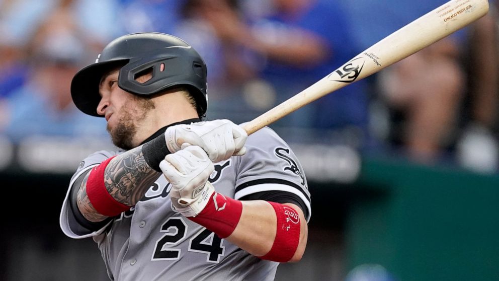 Chicago White Sox's Yasmani Grandal hits an RBI single during the third inning of a baseball game against the Kansas City Royals Saturday, Sept. 4, 2021, in Kansas City, Mo. (AP Photo/Charlie Riedel)