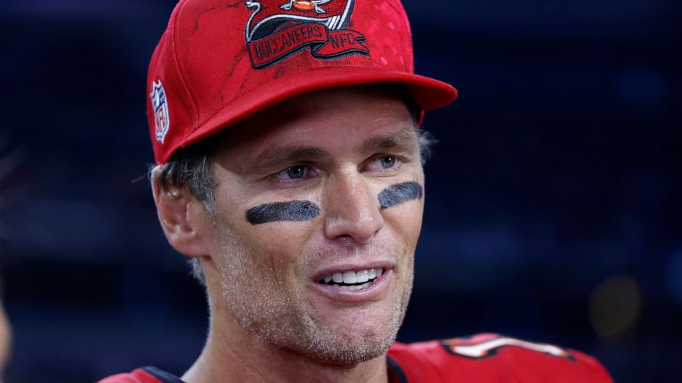 Tampa Bay Buccaneers quarterback Tom Brady gives a broadcast interview after the team's NFL football game against the Dallas Cowboys in Arlington, Texas, Sunday, Sept. 11, 2022. (AP Photo/Ron Jenkins)