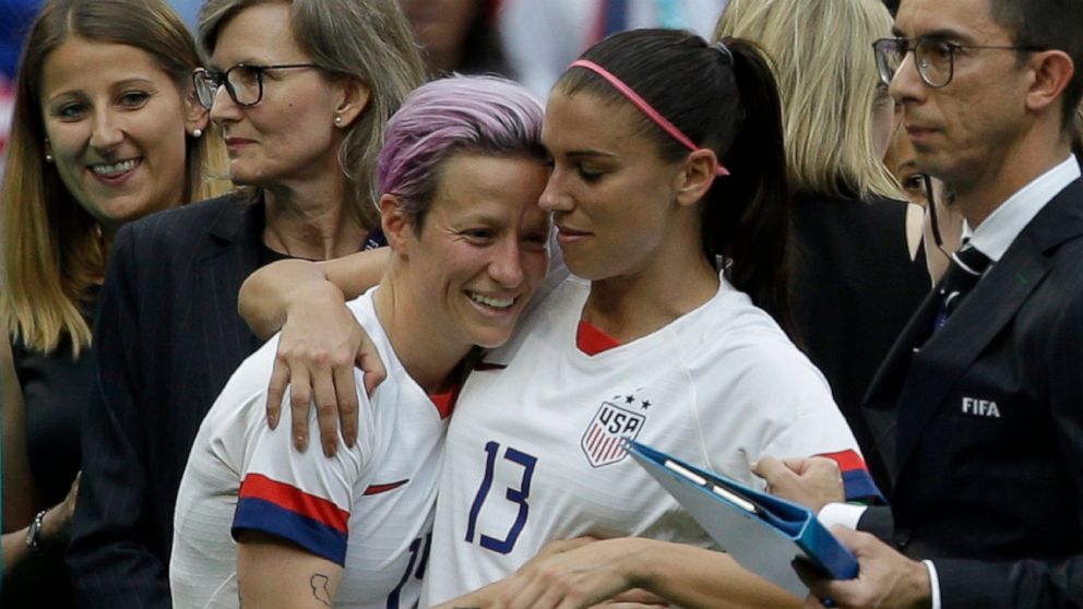FILE - United States' Megan Rapinoe, left, and Alex Morgan celebrate after winning the Women's World Cup final soccer match between U.S. and The Netherlands at the Stade de Lyon in Decines, outside Lyon, France, Sunday, July 7, 2019. Rapinoe and Morg