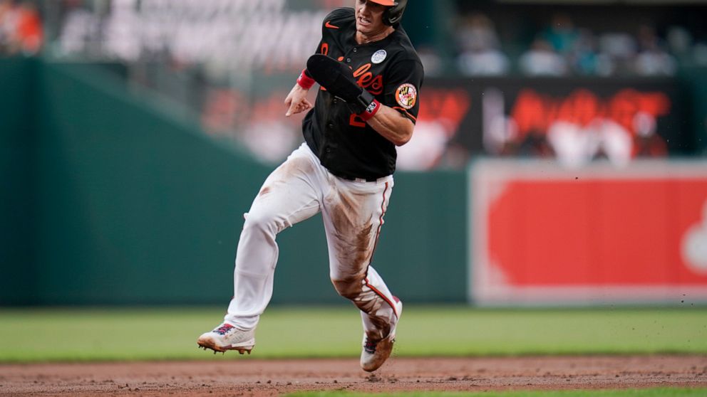 Baltimore Orioles' Austin Hays runs the bases while scoring on a double by Ryan Mountcastle during the first inning of a baseball game against the Seattle Mariners, Thursday, June 2, 2022, in Baltimore. (AP Photo/Julio Cortez)