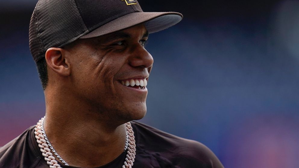 San Diego Padres right fielder Juan Soto smiles during batting practice before team's baseball game against the Colorado Rockies on Wednesday, Aug. 3, 2022, in San Diego. (AP Photo/Gregory Bull)