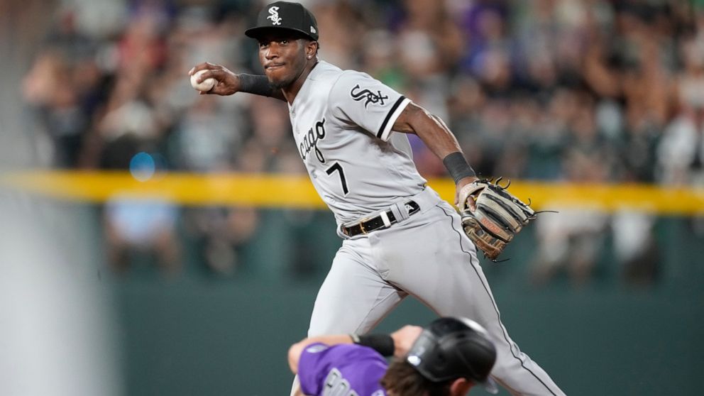 Chicago White Sox shortstop Tim Anderson, back, forces out Colorado Rockies' Brendan Rodgers at second base on the front end of a double play hit into by Ryan McMahon to end the sixth inning of a baseball game Tuesday, July 26, 2022, in Denver. (AP P