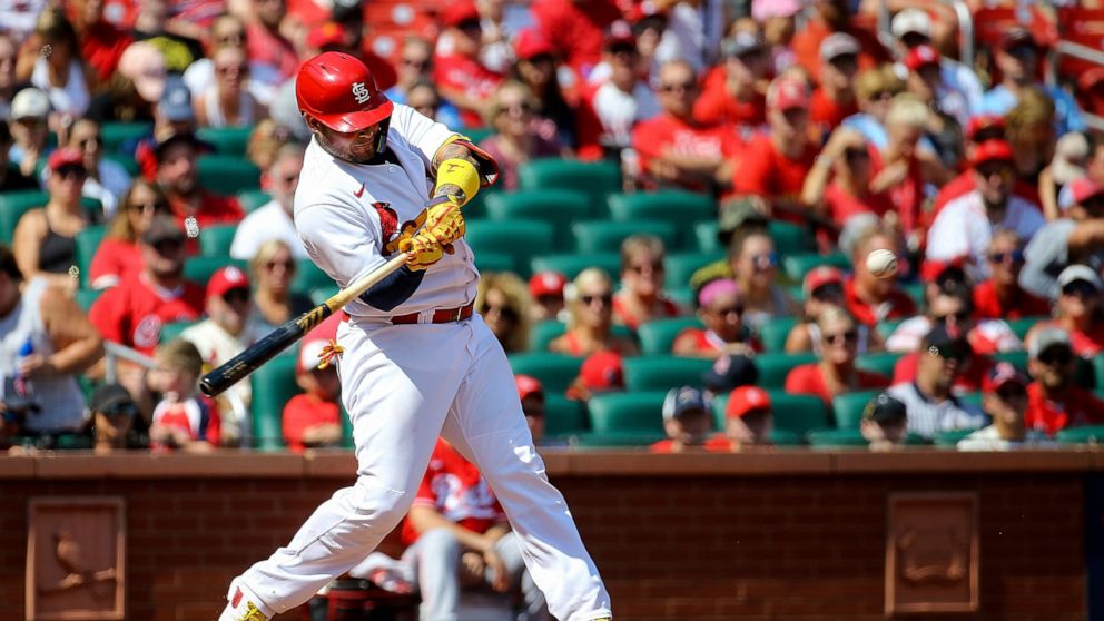 St. Louis Cardinals' Yadier Molina hits a two-run home run during the third inning in the first baseball game of a doubleheader against the Cincinnati Reds, Saturday, Sept. 17, 2022, in St. Louis. (AP Photo/Scott Kane)
