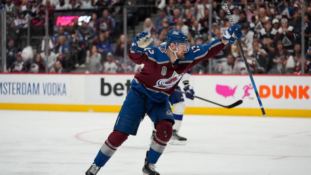 Colorado Avalanche right wing Valeri Nichushkin celebrates his goal against the Tampa Bay Lightning during the second period in Game 2 of the NHL hockey Stanley Cup Final, Saturday, June 18, 2022, in Denver. (AP Photo/John Locher)