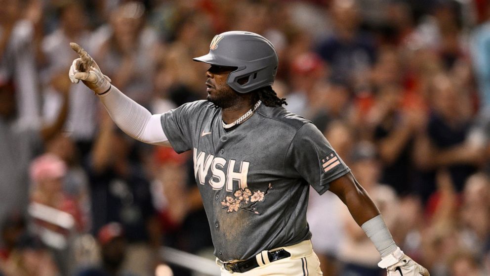Washington Nationals' Josh Bell celebrates his three-run home run during the seventh inning of the team's baseball game against the St. Louis Cardinals, Saturday, July 30, 2022, in Washington. The Nationals won 7-6. (AP Photo/Nick Wass)