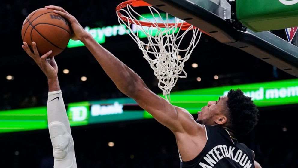 Milwaukee Bucks forward Giannis Antetokounmpo (34) blocks a shot by Boston Celtics center Al Horford (42) during the second half of Game 5 of an Eastern Conference semifinal in the NBA basketball playoffs, Wednesday, May 11, 2022, in Boston. The Buck