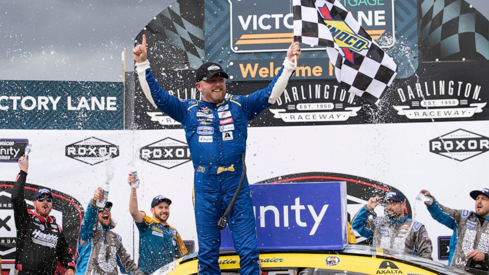 Justin Allgaier (7) celebrates in Victory Lane after winning the NASCAR Xfinity auto race at the Darlington Raceway on Saturday, May 7, 2022, in Darlington, S.C. (AP Photo/Matt Kelley)