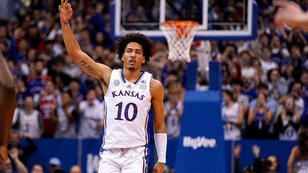 Kansas forward Jalen Wilson celebrates after making a basket during the first half of an NCAA college basketball game against Seton Hall Thursday, Dec. 1, 2022, in Lawrence, Kan. (AP Photo/Charlie Riedel)
