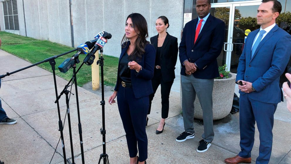 FILE - Attorney Alexandra Benevento, center, speaks with reporters during a news conference announcing a cheerleader abuse lawsuit filed in Tennessee on Sept. 27, 2022, in Memphis, Tenn. The latest lawsuit in a series alleging widespread misconduct a