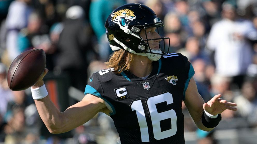 Jacksonville Jaguars quarterback Trevor Lawrence (16) sets back to pass during the first half of an NFL football game against the Dallas Cowboys, Sunday, Dec. 18, 2022, in Jacksonville, Fla. (AP Photo/Phelan M. Ebenhack)