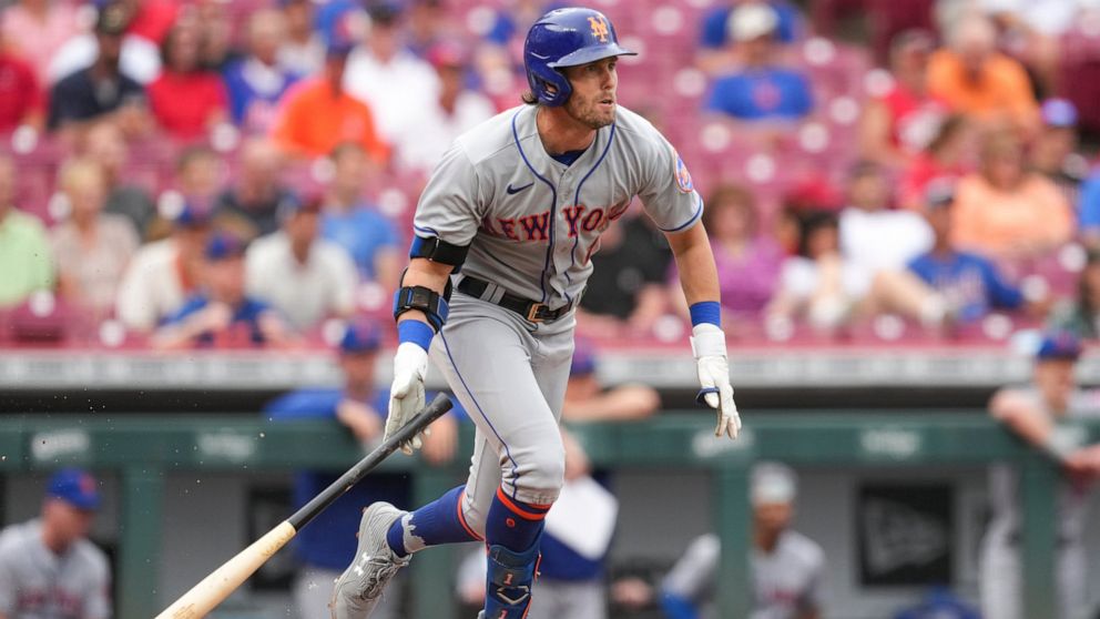 New York Mets' Jeff McNeil watches his RBI single during the first inning of the team's baseball game against the Cincinnati Reds on Wednesday, July 6, 2022, in Cincinnati. (AP Photo/Jeff Dean)