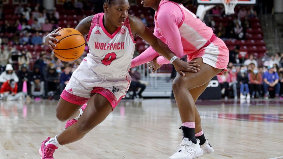 North Carolina State guard Diamond Johnson (0) drives past Boston College guard Marnelle Garraud during the first half of an NCAA college basketball game Thursday, Feb. 10, 2022, in Boston. (AP Photo/Mary Schwalm)