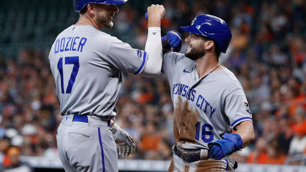 Kansas City Royals' Hunter Dozier celebrates with Andrew Benintendi after hitting a two-run home run off Houston Astros starting pitcher Cristian Javier during the first inning of a baseball game Wednesday, July 6, 2022, in Houston. (AP Photo/Kevin M