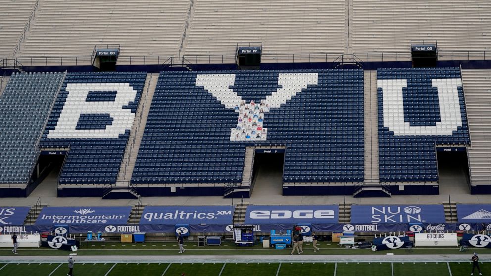 FILE - LaVell Edwards Stadium is empty of fans, during the coronavirus pandemic, before an NCAA college football game between BYU and Troy on Saturday, Sept. 26, 2020, in Provo, Utah. An investigation by Brigham Young University into allegations that
