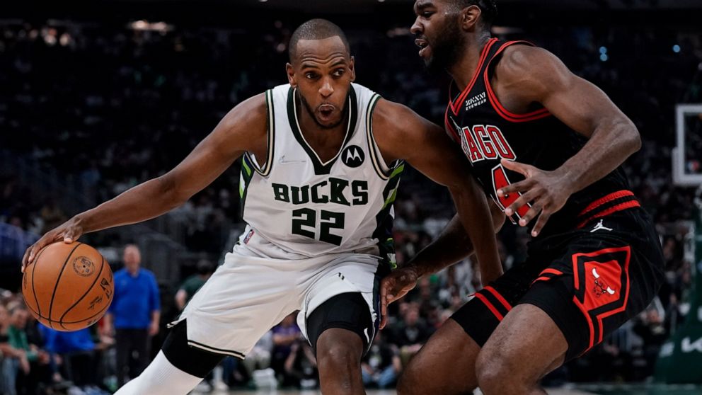 Milwaukee Bucks' Khris Middleton tries to get past Chicago Bulls' Patrick Williams during the first half of Game 2 of their first round NBA playoff basketball game Wednesday, April 20, 2022, in Milwaukee. (AP Photo/Morry Gash)