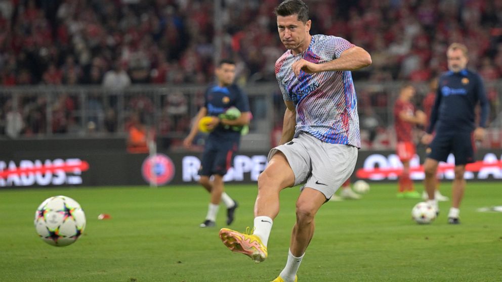 Barcelona's Robert Lewandowski warms up prior to the Champions League, group C soccer match between Bayern Munich and Barcelona at the Allianz Arena in Munich, Germany, Tuesday, Sept. 13, 2022. (AP Photo/Andreas Schaad)