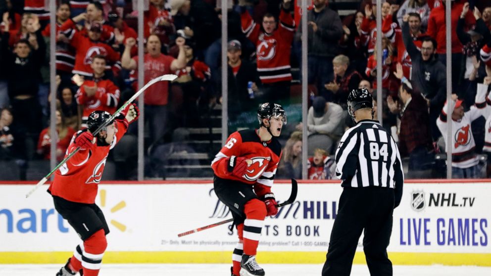 Hughes scores 1st NHL goal in Devils' 1 