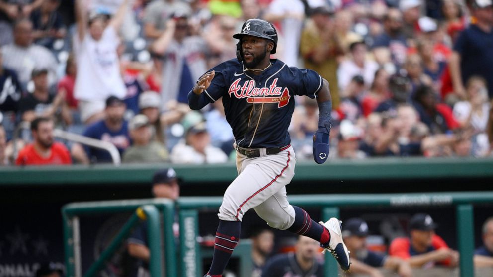Atlanta Braves' Michael Harris II runs home to score on a double by Dansby Swanson during the seventh inning of a baseball game against the Washington Nationals, Saturday, July 16, 2022, in Washington. (AP Photo/Nick Wass)
