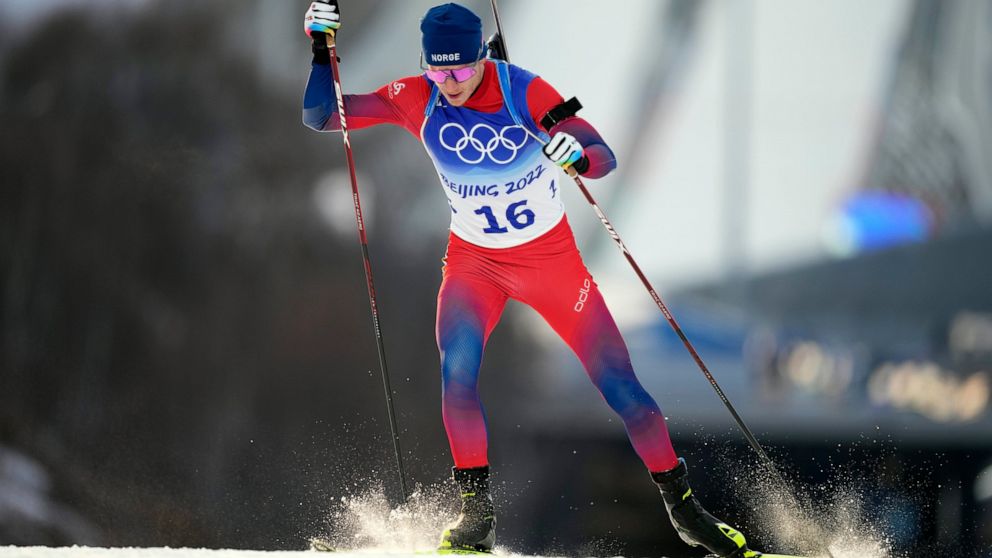 Johannes Thingnes Boe of Norway skis during the men's 10-kilometer sprint competition at the 2022 Winter Olympics, Saturday, Feb. 12, 2022, in Zhangjiakou, China. (AP Photo/Frank Augstein)