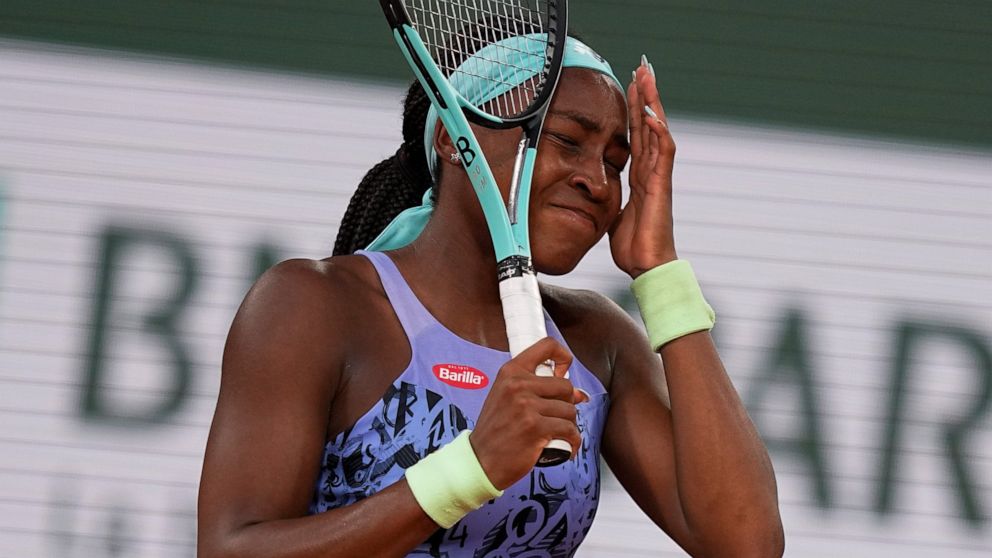 Coco Gauff of the U.S. reacts after missing a shot against Poland's Iga Swiatek during the final match at the French Open tennis tournament in Roland Garros stadium in Paris, France, Saturday, June 4, 2022. (AP Photo/Michel Euler)