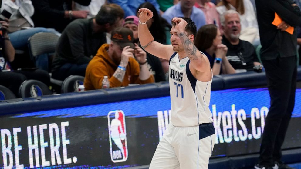 Dallas Mavericks guard Luka Doncic (77) walks off the court after he was called for a foul during the second half of Game 3 of an NBA basketball second-round playoff series against the Phoenix Suns, Friday, May 6, 2022, in Dallas. (AP Photo/Tony Guti